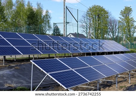 Large, ground level solar panels powering the local school complex