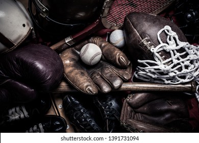 A Large Group Of Assorted Vintage Antique Sports Equipment. Including Football Helmet, Baseball And Boxing Gloves Etc.