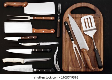 Large Group Of Cookware Isolated On Black Background. Many Knives  And Grilling Tool On Black Table. Collection Of Different Utensils For Cookout Food, Abstract Pattern. Set Of Many Cookware Objects