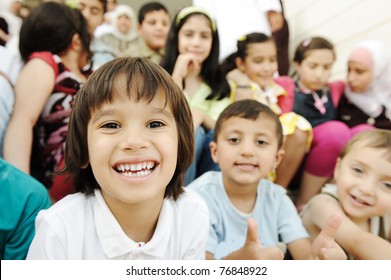 Large Group, Crowd, Lot Of Happy Children Of Different Ages, Summer Outdoor Sitting