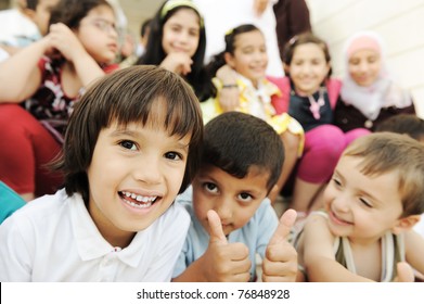 Large Group, Crowd, Lot Of Happy Children Of Different Ages, Summer Outdoor Sitting