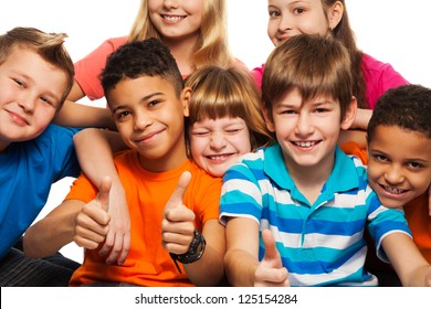 Large Group Of Diversity Happy Kids Boys And Girls Of Age 8-11 Years Old With One Of Them Thumbs Up And Smile