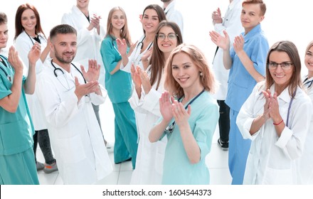 Large Group Of Doctors Congratulating Each Other With Applause