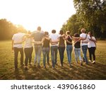 large group of friends together in a park having fun