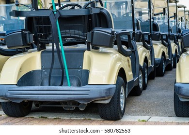 Large Group Of Golf Carts Lined Up Waiting For Golfers.