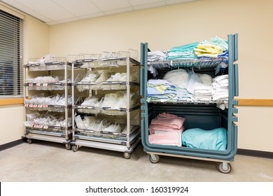 Large Group Of Hospital Supplies Arranged In Trolleys