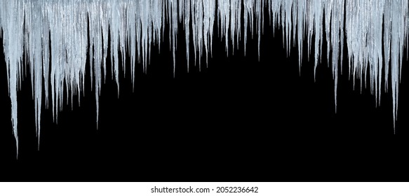 large group of icicles isolated on black background