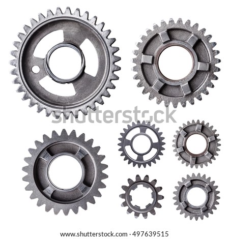 A large group of individual metal gears isolated on a white background. 