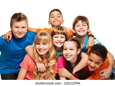Large Group Of Kids Age 8-11 Hugging, Smiling And Laughing, Boys And Girls
