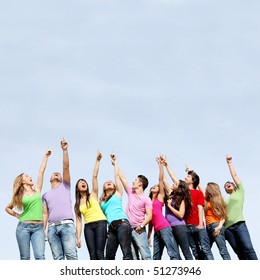 Large Group Of Mixed Race Kids Pointing To Blank Space