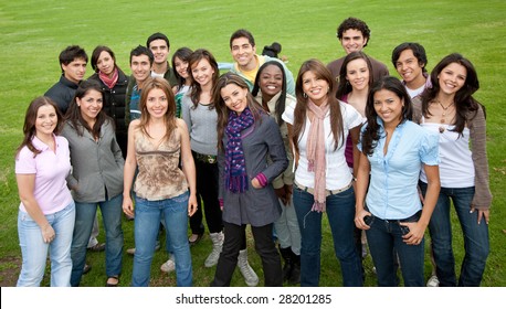 Large Group Of People Smiling Outdoors