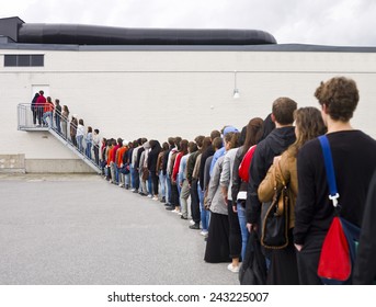 Large Group Of People Waiting In Line