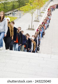 Large Group Of People Waiting In Line