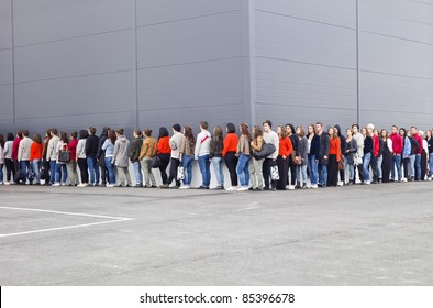 Large Group Of People Waiting In Line