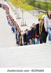 Large Group Of People Waiting In Line