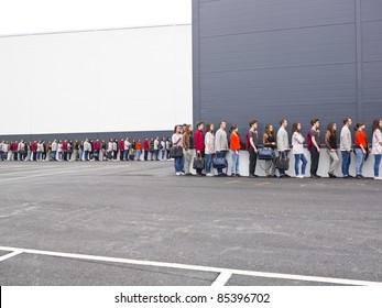 Large Group Of People Waiting In Line