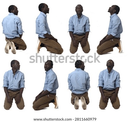 large group of same man sitting on his knees on white background