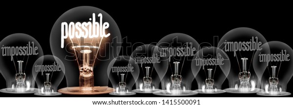 Large group of shining\
and dimmed light bulbs with fibers in a shape of Impossible and\
Possible words isolated on black background; concept of Motivation,\
Success and Change