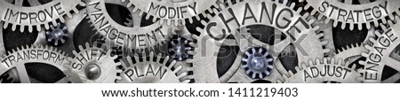 Large group of tooth wheels with Change, Management, Shift, Plan and Strategy concept related words imprinted on metal surface