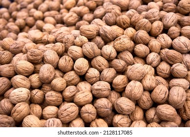 Large Group Of Wallnut Fruit Background. High Quality Photo