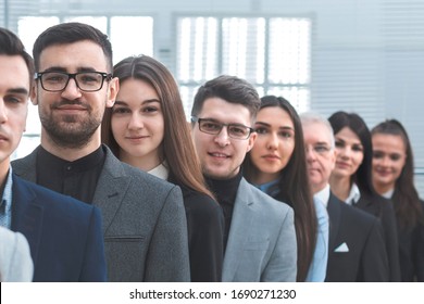 large group of young business people standing in a row. - Shutterstock ID 1690271230