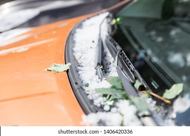 Large Hail Ice Balls On Car Hood After Heavy Summer Storm