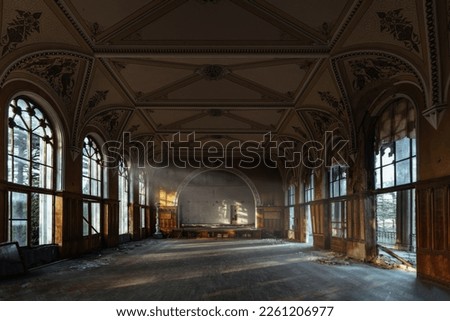 Large hall of abandoned building in gothic style.