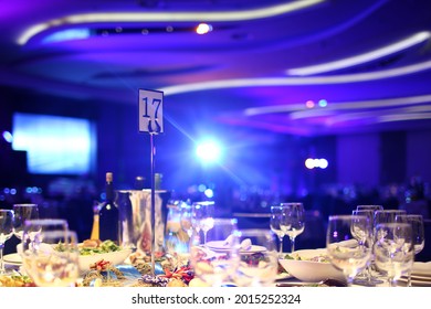 large hall with laid tables awaits guests - Shutterstock ID 2015252324