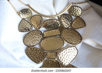 A Large Hammered Gold Statement Necklace