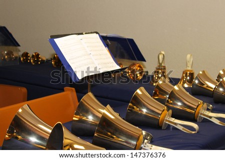 Large handbells set in a row and ready for performance