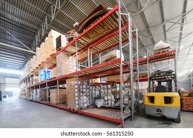 Large hangar warehouse industrial and logistics companies. Boxes and containers with goods placed on high shelves.