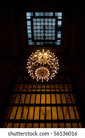 A Large Hanging Chandelier Inside The New York Grand Central Terminal Train Station.