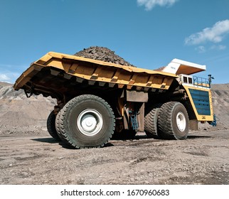 Large Heavy Dumb Truck At The Coal Mining Area.