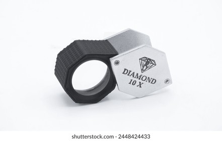 Large Hexagon Diamond Loupe eye lens pocket magnifier, Black, 10X used by jewelers, watch makers, gemstone inspecting for grading and clarity of stones. isolated on white background version 1
 - Powered by Shutterstock