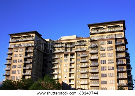 A large high rise commercial apartment, condominium building.
