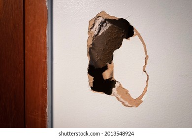 Large Hole In Damaged Drywall, In Need Of Repair