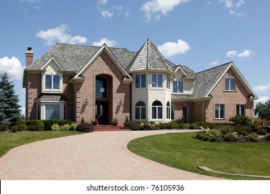 Large Home In Suburbs With Turret And Arched Entry