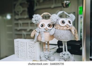 Large Homemade Stuffed Toys Of An Owl With Big Eyes And Long Legs. Photography, Concept.