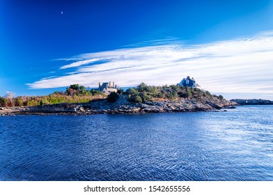 Large Homes Lining The Coastline In Newport Rhode Island On A Sunny Blue Sky Autumn Day.