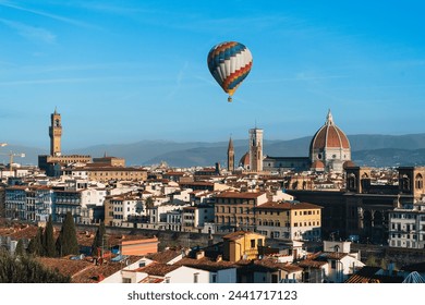 A large hot air balloon over the center of Florence. View of the renaissance capital from Piazza Michelangelo. Santa Maria del Fiore. - Powered by Shutterstock