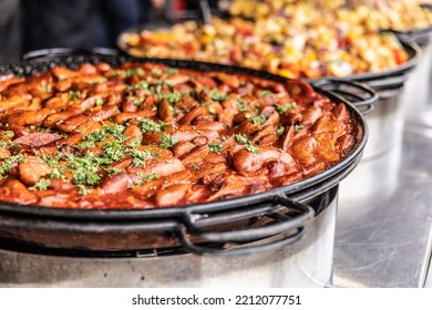 Large Hot Pan Full Of Wintery Comfort Food In A Form Of Suasage And Tomato Paste Stew.