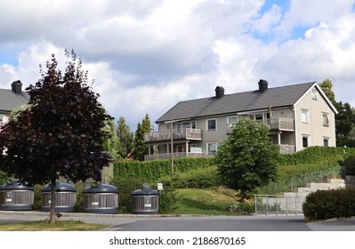 Large House Dormitory Apartments In One Building Recycling Garbage Cans And Parking Space Outside Exterior - Norway 5 August 2022