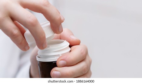 Large Image Of A Jar With A Lid In The Hands Of A Child