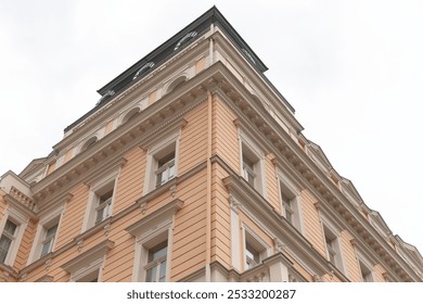 A large and impressive building with a large clock prominently displayed on the top of it, making it a notable landmark in the skyline - Powered by Shutterstock