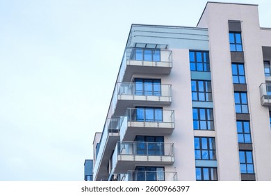 A large and impressive building that features numerous windows along its facade and multiple balconies for outdoor views and enjoyment