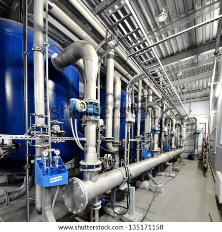 Large industrial boiler room, shiny pipes and details close-up. Industry, technology, special equipment, water treatment, biotechnology, chemistry, ecology, environmental damage and conservation