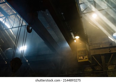 Large industrial crane operating in a foundry - Powered by Shutterstock