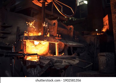 Large industrial foundry furnace with hit iron inside. Equipment for metallurgy and heavy industry.