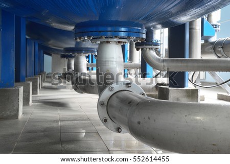 Large industrial water treatment and boiler room. Bottom of large pressure vessels