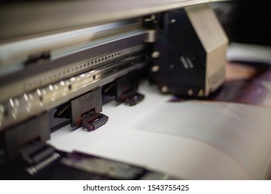 Large Inkjet Printer With Printing On Vinyl Paper With Lighting In Workplace